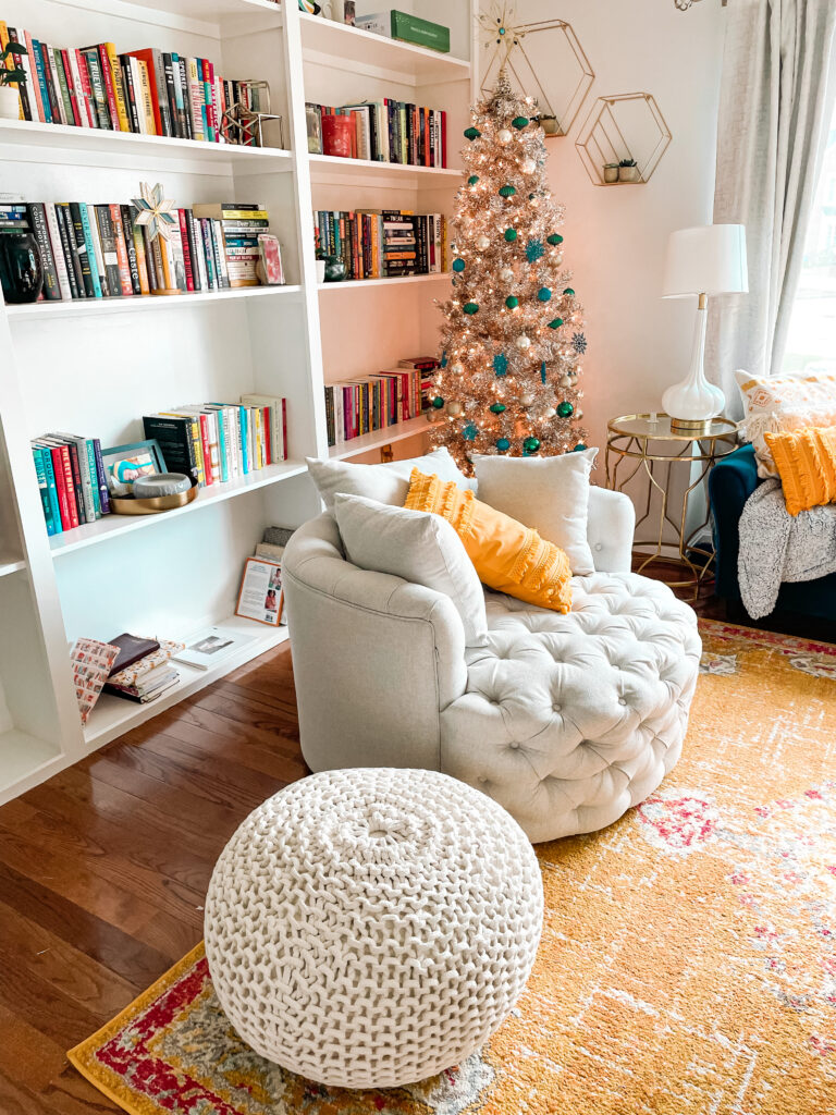 Reading chair, foot stool and gold Christmas tree in my in-home library