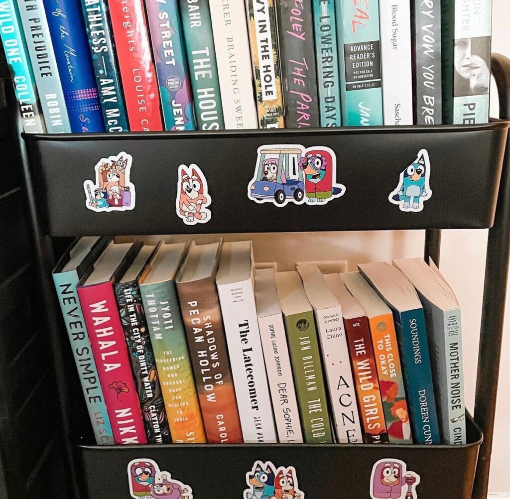 My black book cart covered in stickers and filled with books