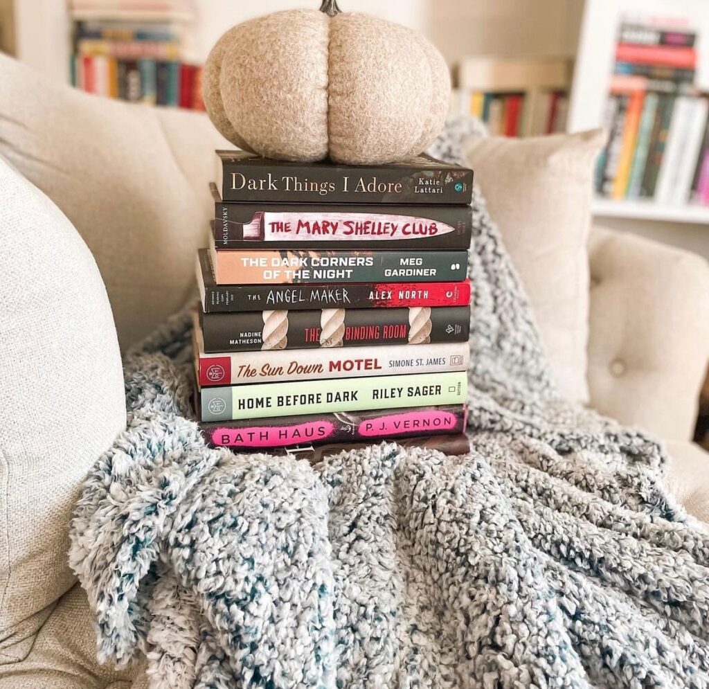 bookstagram content ideas -book stack challenges. A stack of books for spooky season 